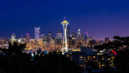 Seattle's space needle light by the glow of the lights from the city below